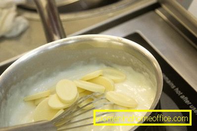 Stirring regularly, add butter and white chocolate to the milk mixture.